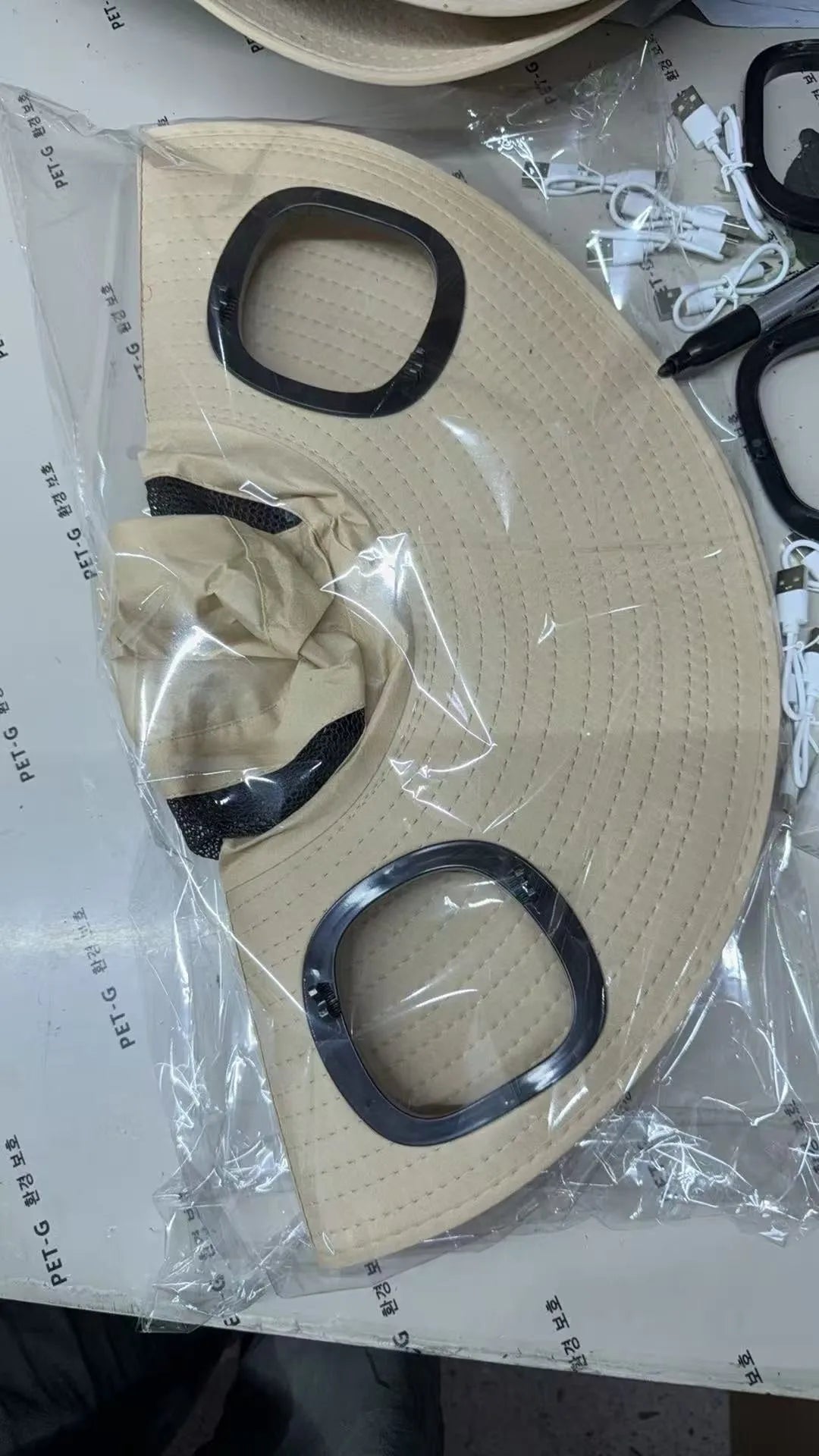 Men's grey sun shading cap with large eave and integrated solar fan for outdoor cooling