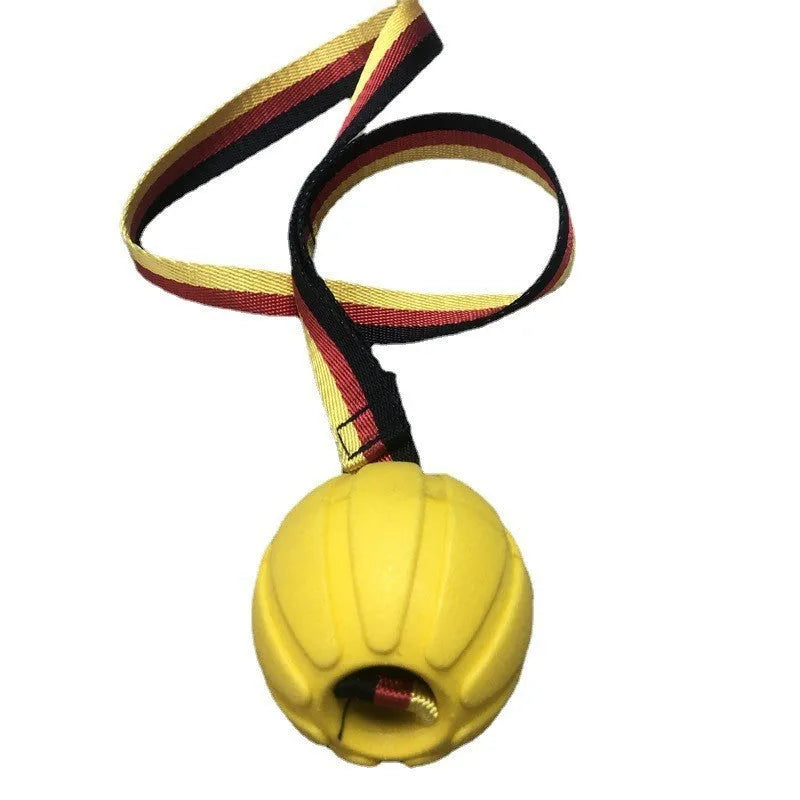 Yellow and camouflage coloured EVA floating dog training balls in different sizes on a blue background.