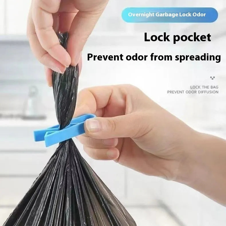 White PP plastic non-slip clip for fixing a bin liner to the side of a kitchen rubbish bin.