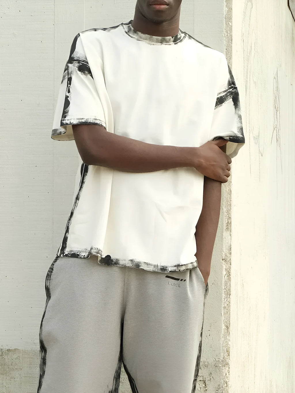 Women's white short sleeve top with draped design and printed pattern in casual style