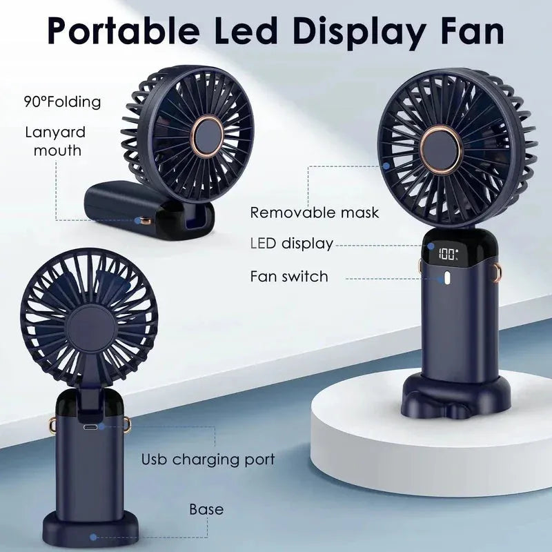Blue portable USB rechargeable fan shown in handheld mode, with folding neck strap and digital battery display