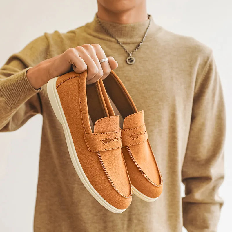 Men's suede leather slip-on casual shoe in a solid colour with a round toe and low flat heel.