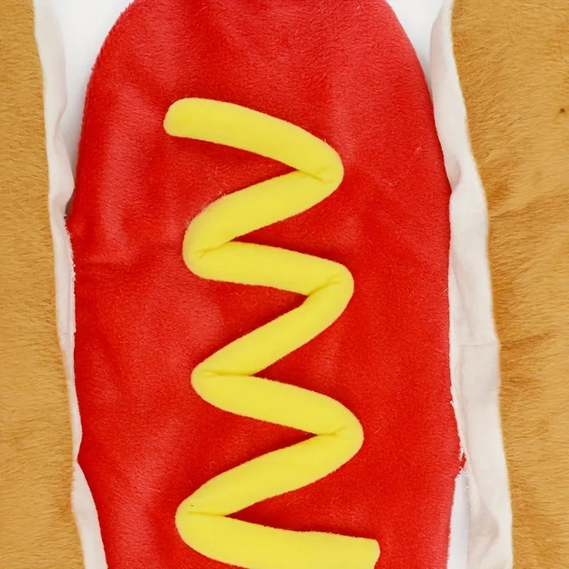 Dog wearing a red and brown hot dog costume with a fleece lining and hook-and-loop belly closure.