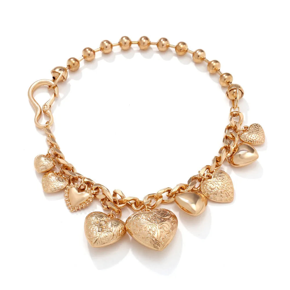 Gold carved heart pendant necklace on a metal chain, adjustable from 41cm to 50cm.