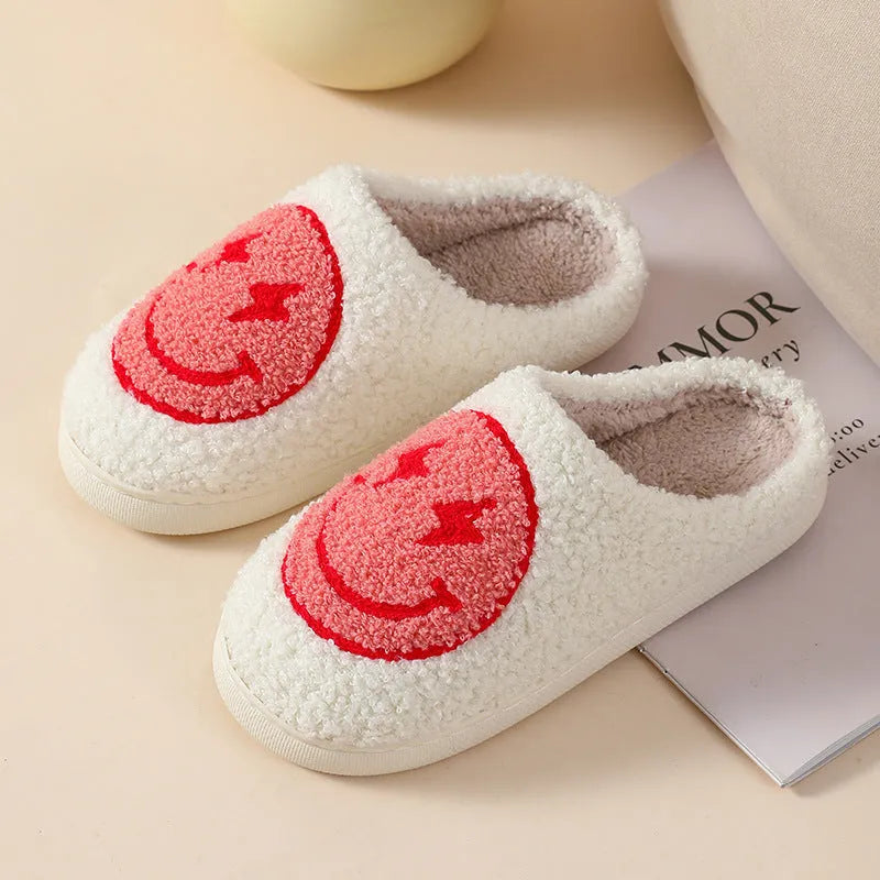 Women's cartoon love style plush slippers in blue smiley colour with round toe and non-slip sole.