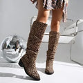 Brown women's leopard print ankle boots with a square toe and chunky mid-heel on a plain background.