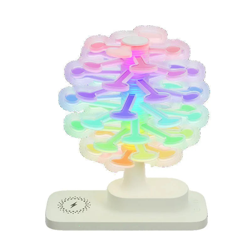 Modern geometric spiral tree shaped LED desk lamp on a wooden surface