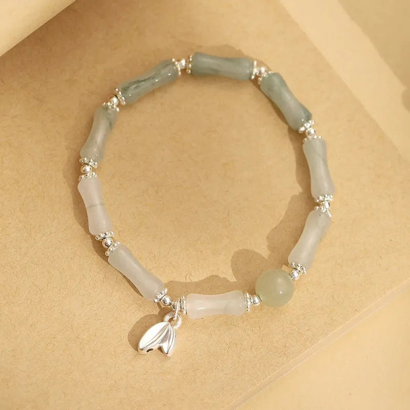 Natural Tianshan green bamboo sterling silver bracelet for women with antique style.