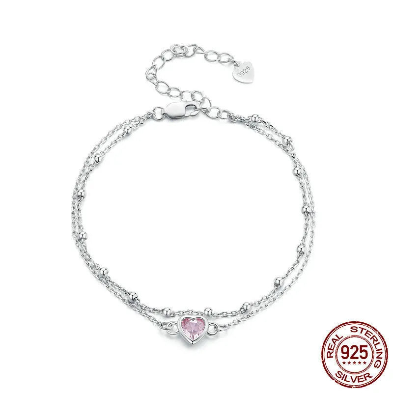 Women's sweet style 925 silver bracelet with small heart-shaped pendant on an adjustable chain.