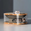Transparent white PVC cat tunnel nest attached to a corrugated board scratch pad.