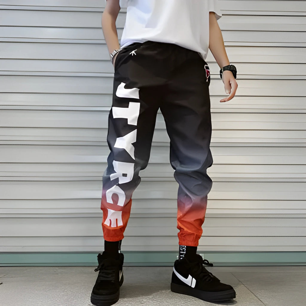 Men's gradient colour high waist nine trousers in polyester blend, available in black, blue, and white.