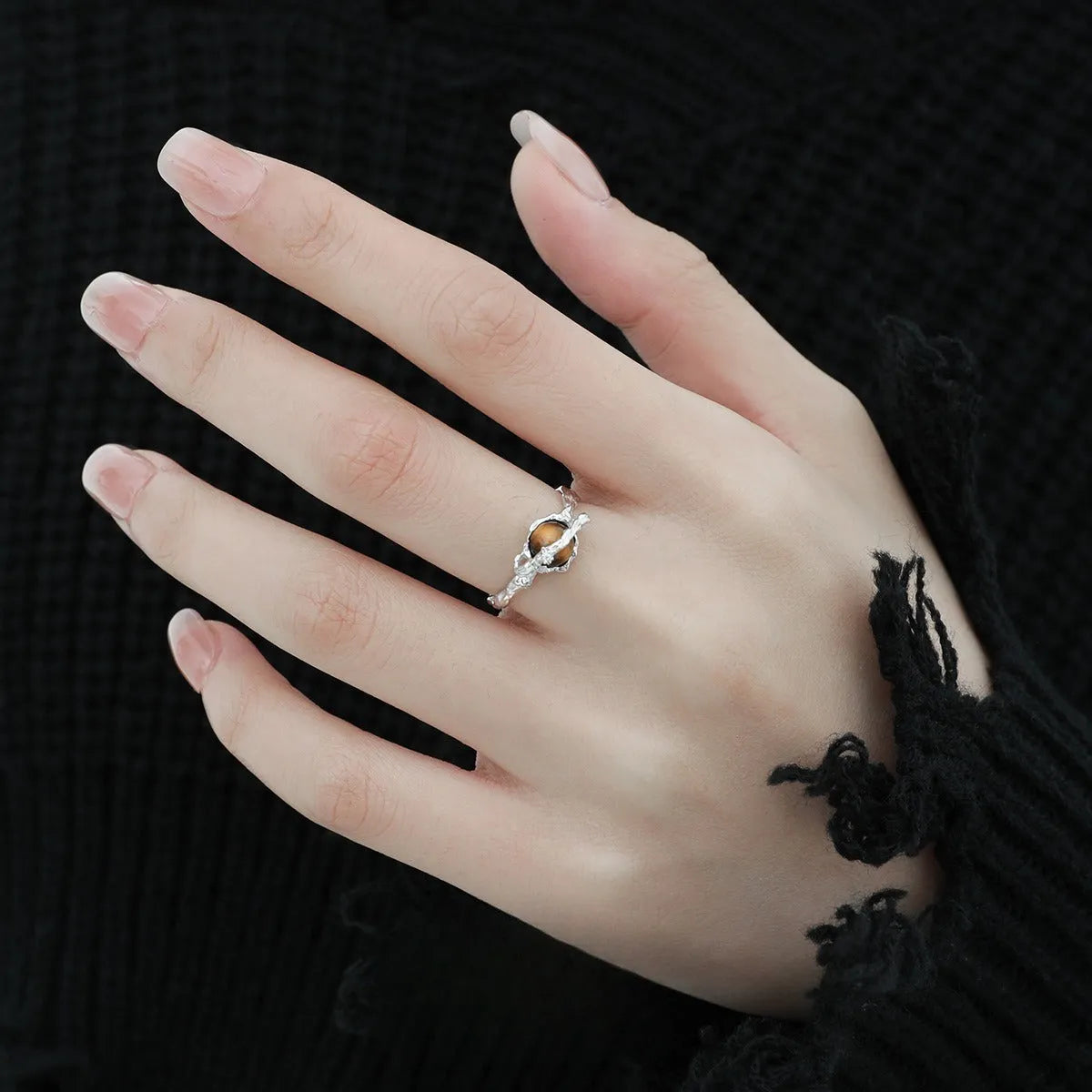 Saturn design adjustable silver ring with white gold electroplated finish and tigereye open pattern