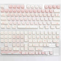Full set of PBT dye-sublimated key caps for mechanical keyboard, showing vibrant colours and over 98 keys.