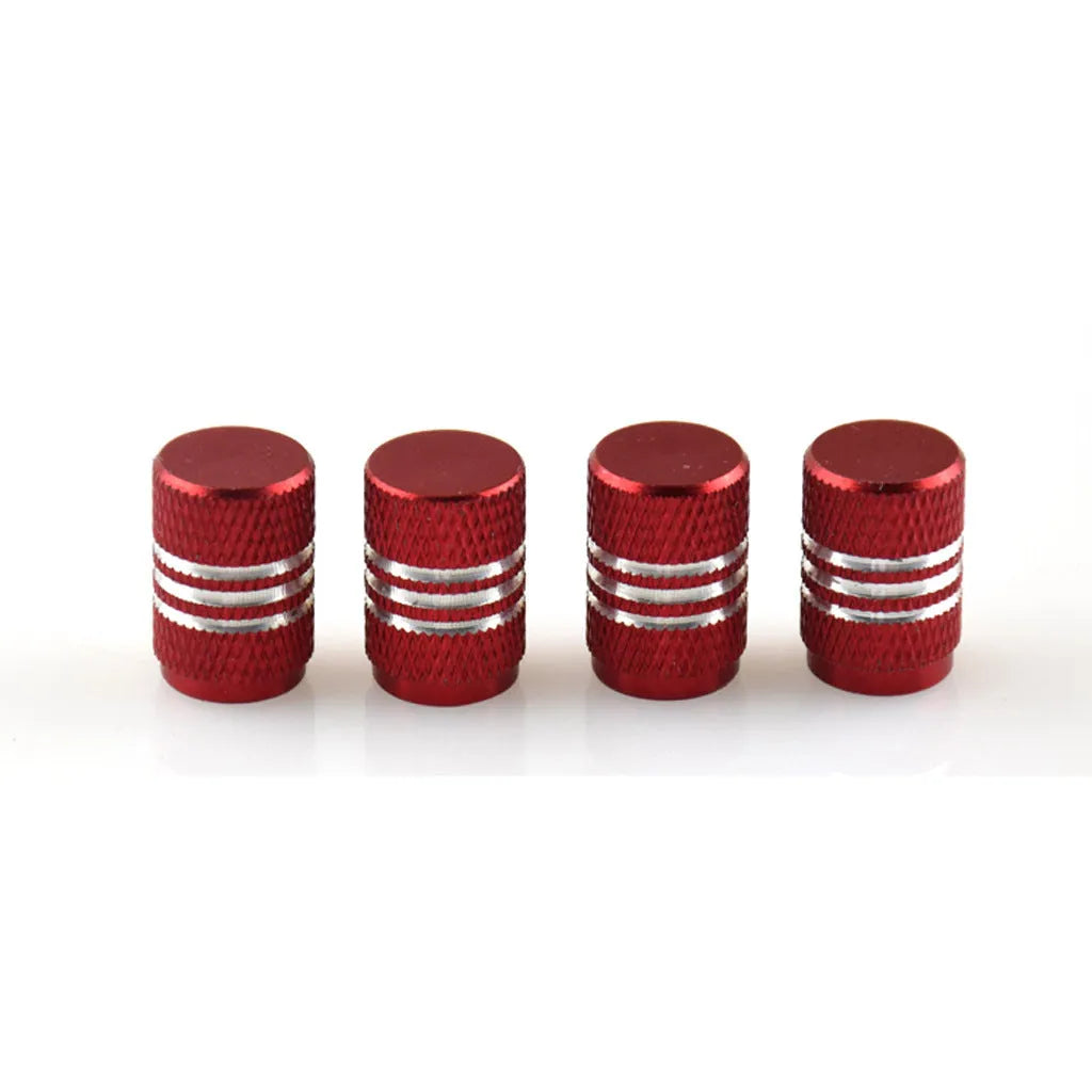 Set of stainless steel car tyre valve caps in multiple colours including red, blue, black, and silver.
