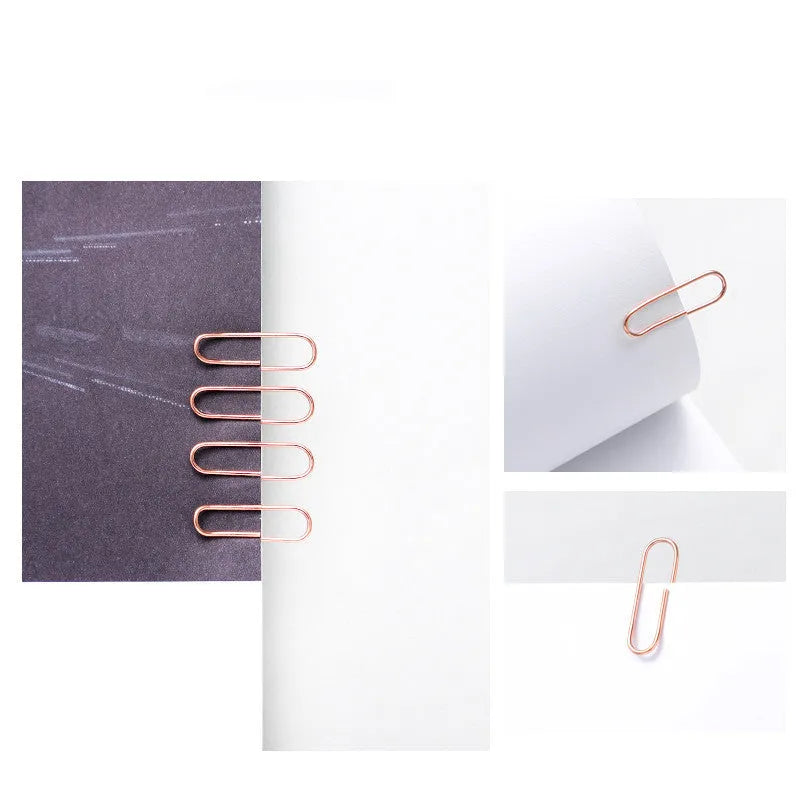 Rose gold heart-shaped metal paper clips, 28mm size, shown in a pack of 100.