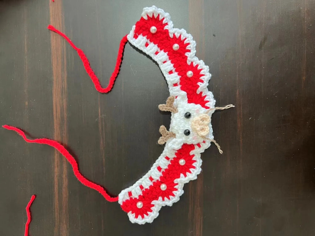 Christmas knitted wool pet scarf with festive patterns attached to dog collar