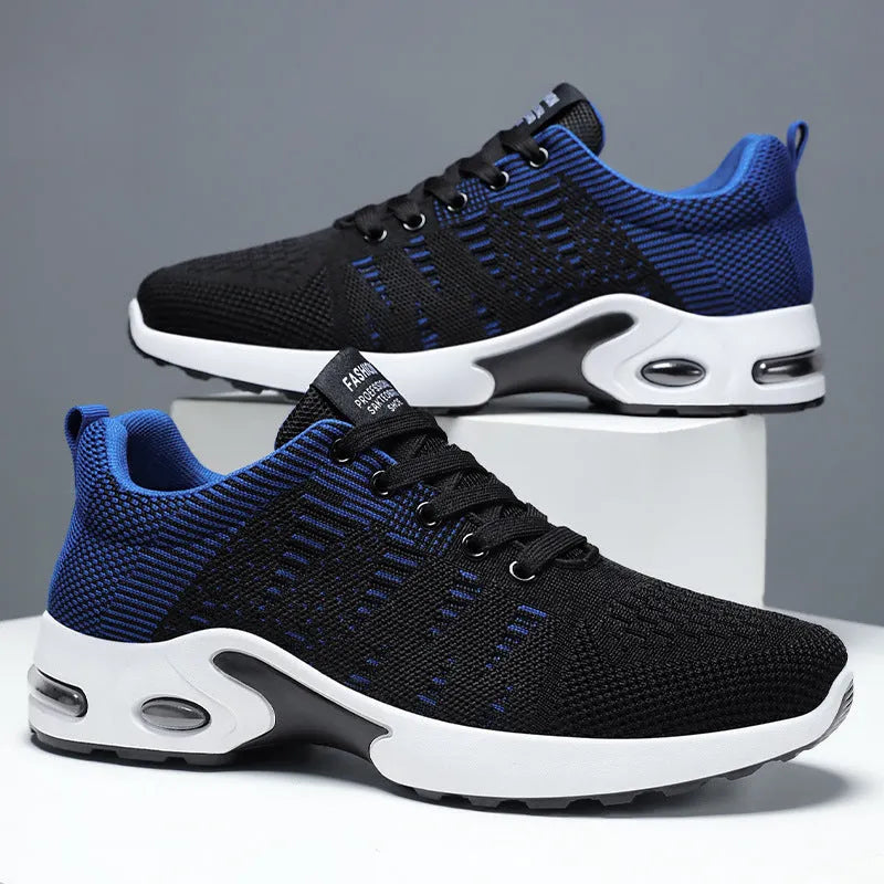 Men's black and grey Flyknit mesh low-top casual sneakers with lace-up front and soft sole.