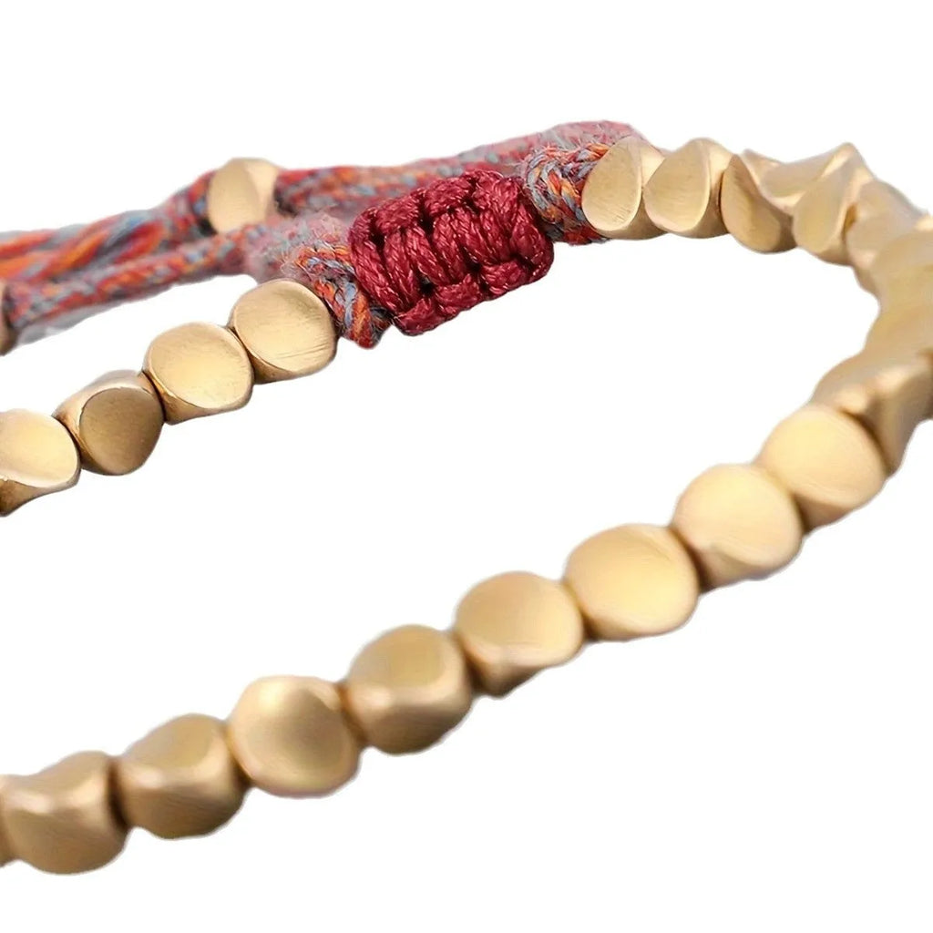 Hand-woven adjustable alloy tassel bracelet in electroplated colour T131 on neutral background
