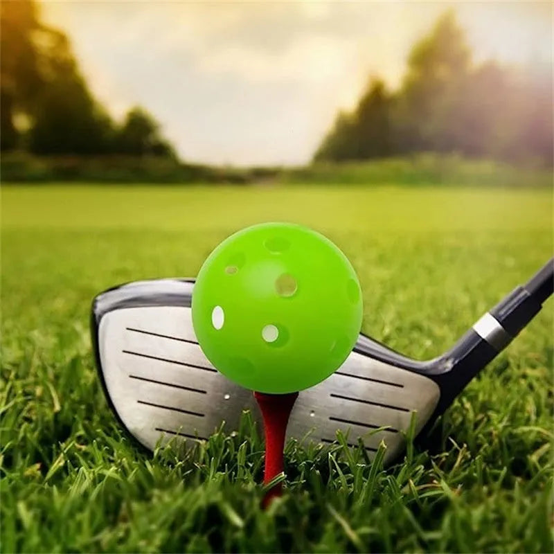 Multi-colour 42mm diameter golf practice balls with 26-hole design in a net pocket