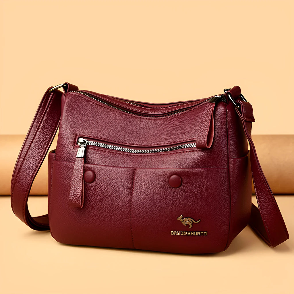 Soft square black PU leather women's crossbody shoulder bag showing front view and open interior with multiple pockets.