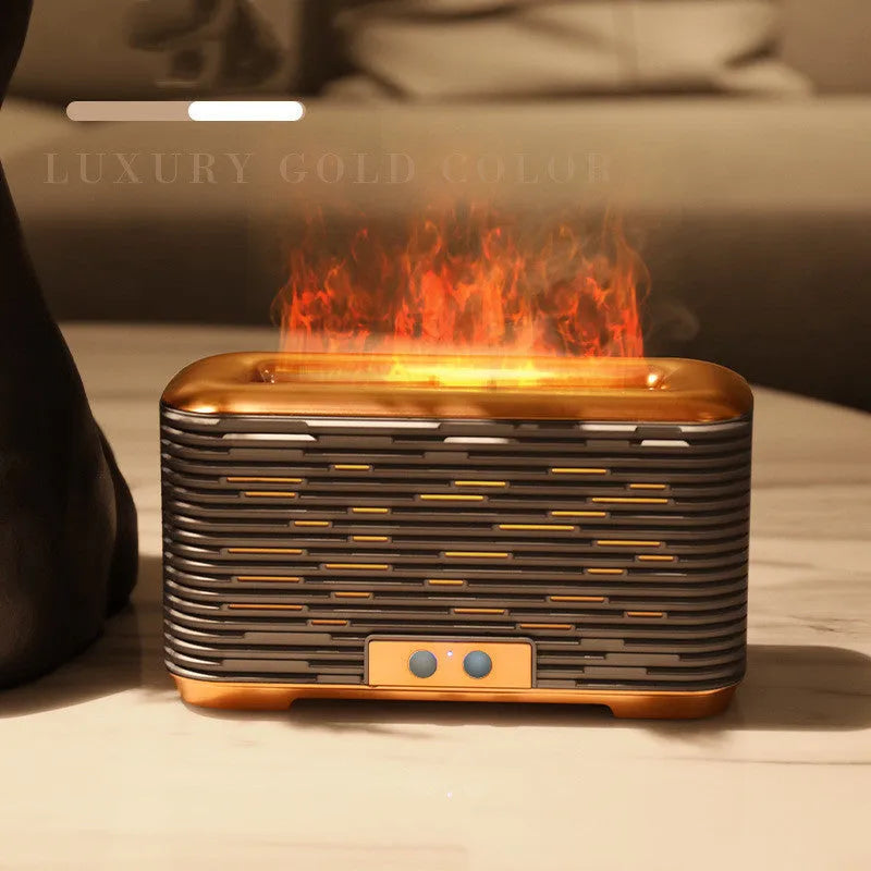 Flame aroma diffuser humidifier in gold with double-colour atmosphere light on a desktop