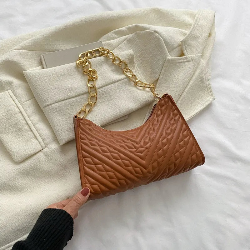 Brown PU leather pleated chain baguette shoulder bag showing adjustable strap and square shape