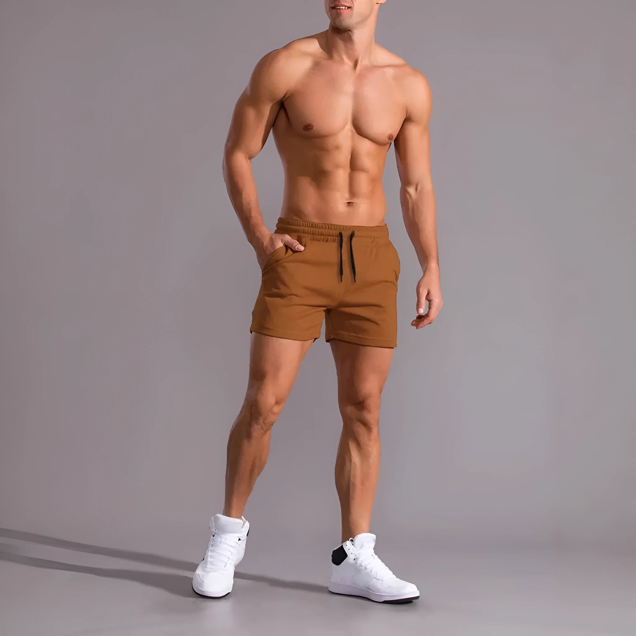Men's black, khaki and light brown drawstring elastic shorts laid flat, 3-piece set