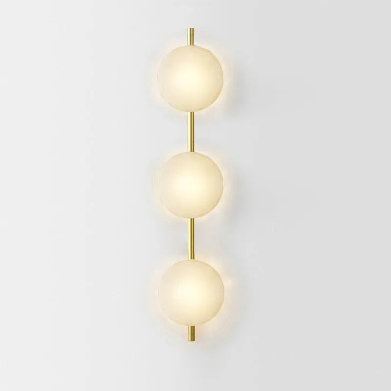 Bedside hotel wall lamp with iron construction and choice of glass shades including long brush holder style