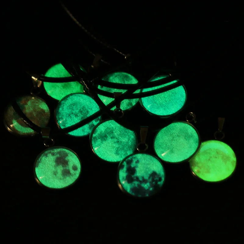 Luminous alloy moon and constellation pendant necklace with a coloured glass cabochon on a chain.
