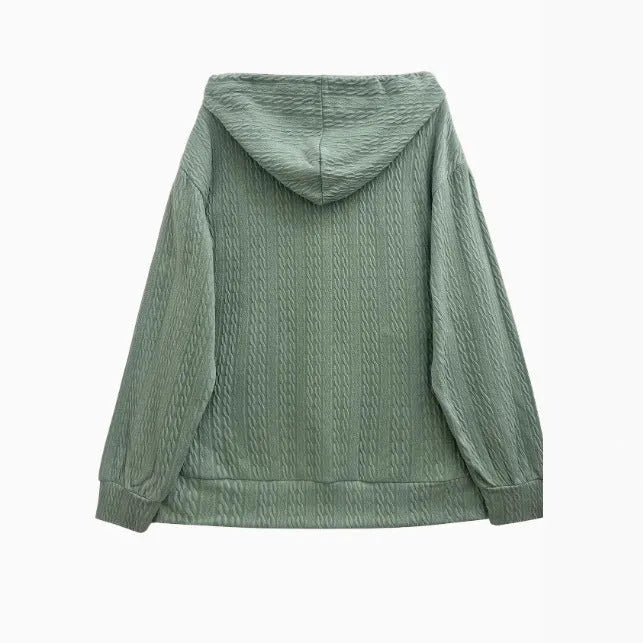 Green women's loose fit hooded zipper coat on a hanger