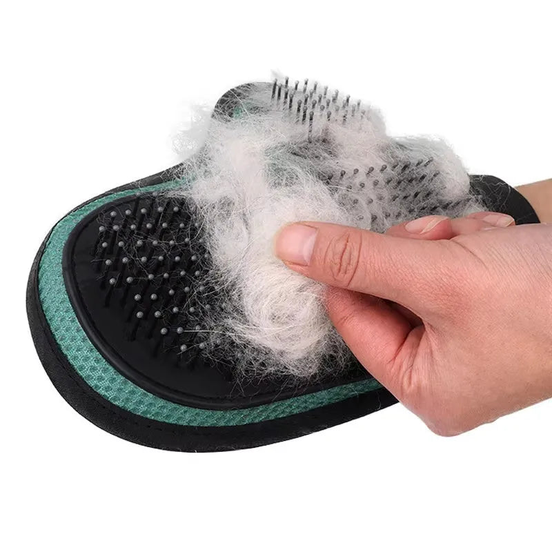 Gray cat hair removal glove with silicone massage tips on hand, adjustable wristband