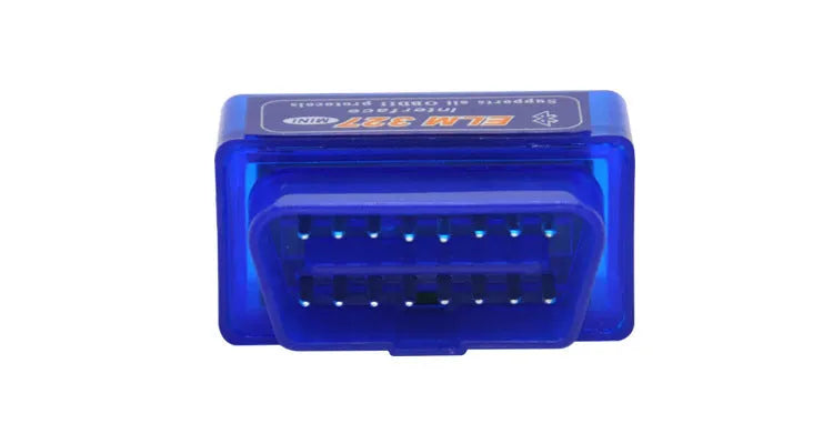 Small black ELM327 OBD2 Bluetooth car diagnostic scanner plugged into a vehicle port.