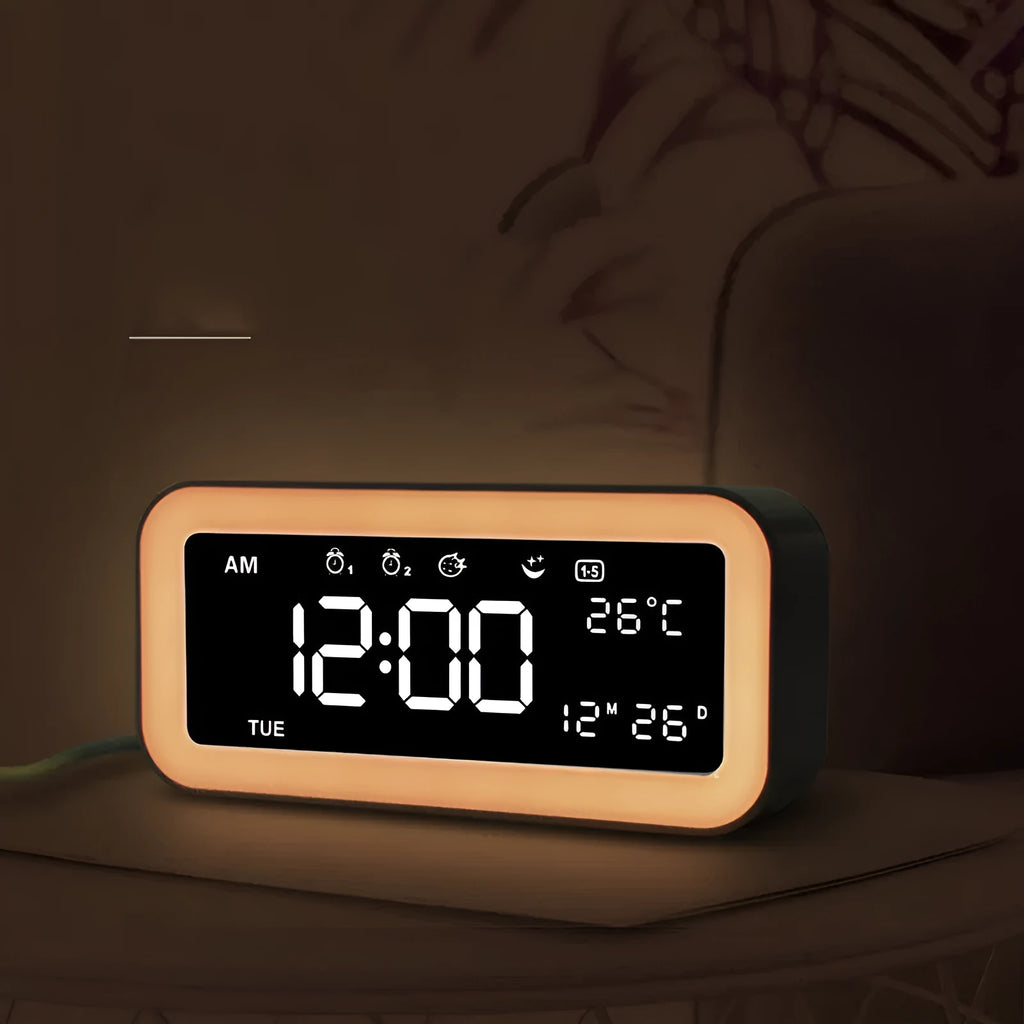 Rectangular blue LED atmosphere alarm clock with digital display on a wooden surface.
