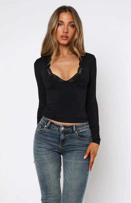 Slim-fit women's blouse with lace flower detailing and long sleeves