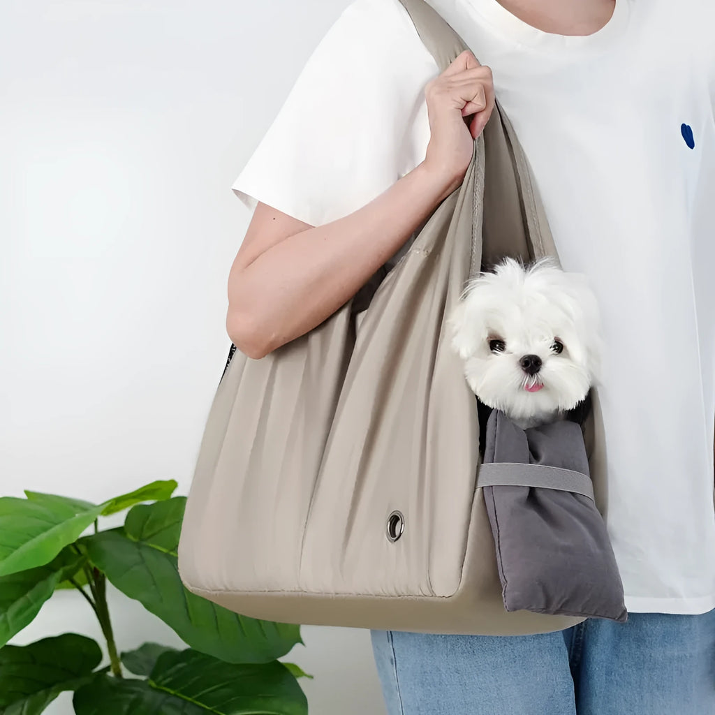 Apricot cloth pet carrier handbag for small dogs or cats, showing handle and breathable fabric.