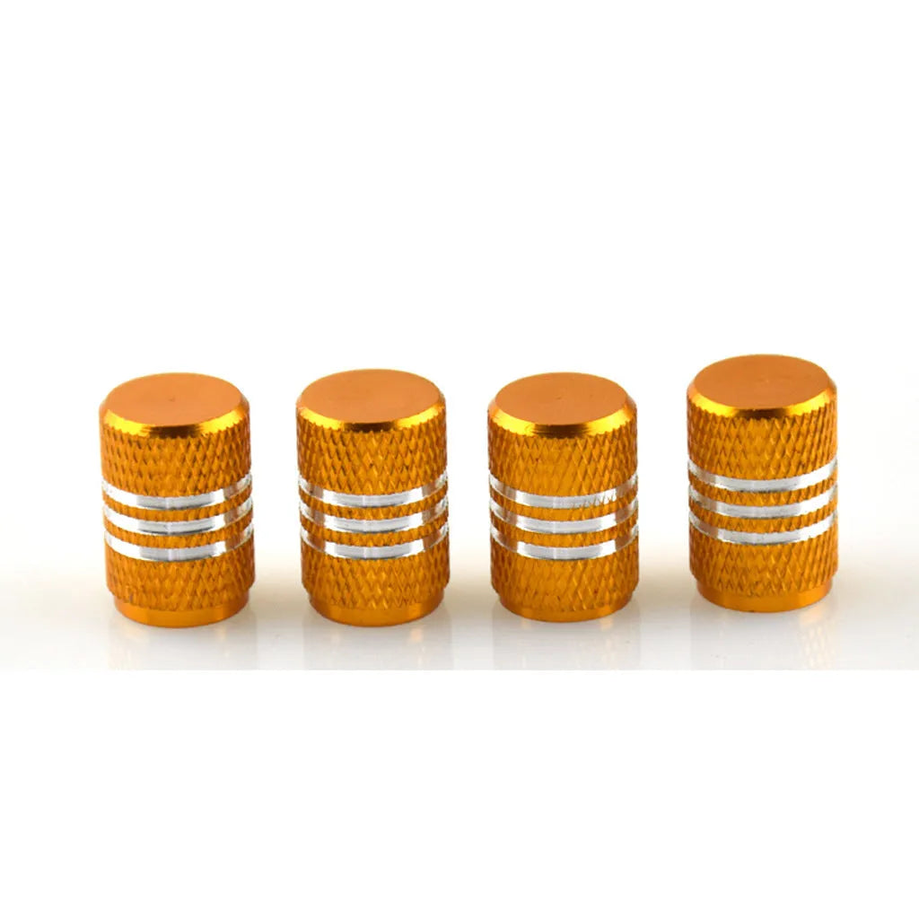 Set of stainless steel car tyre valve caps in multiple colours including red, blue, black, and silver.