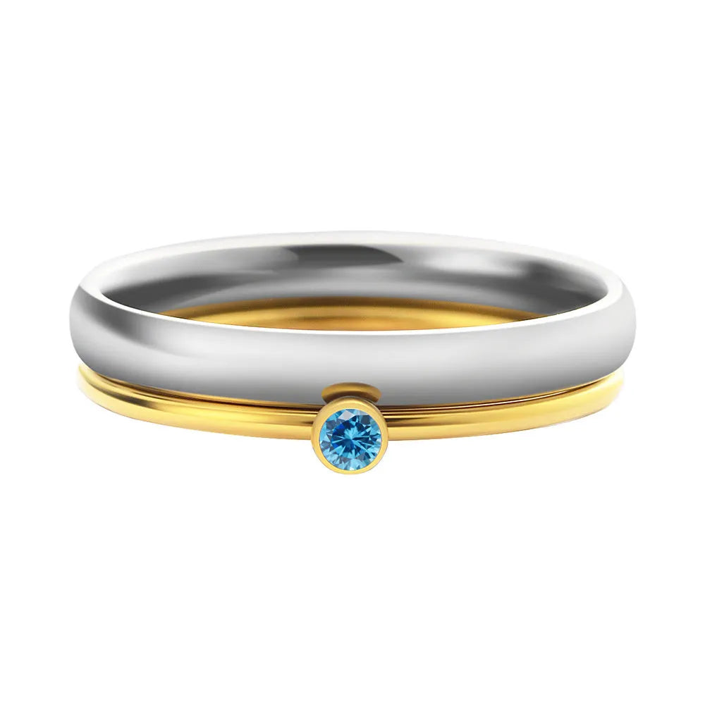 Geometric titanium steel ring with December birthstone colour and engraved gold lettering on band.