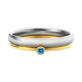 Geometric titanium steel ring with December birthstone colour and engraved gold lettering on band.