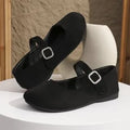 Black canvas women's fisherman shoes with rubber soles shown in low-top casual design