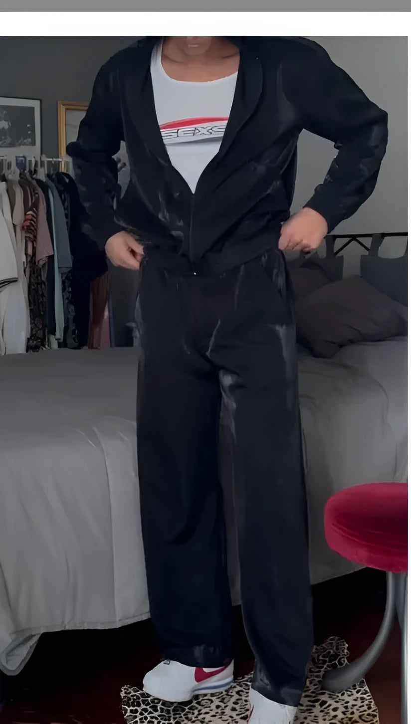 Men's black fashion sports hooded two-piece suit with zip-up jacket and trousers on a model