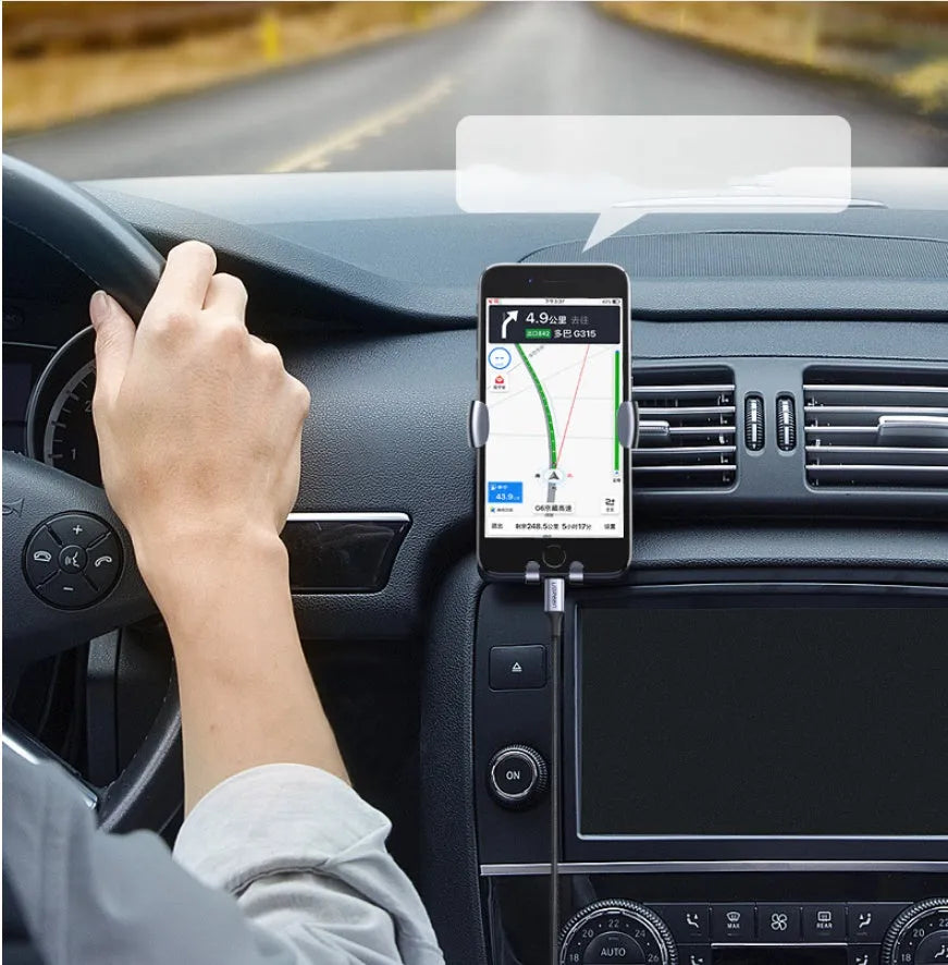 Black braided Apple Lightning to 3.5mm audio adapter cable with aluminium connectors for car use.