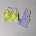 Women's two-piece sportswear set with cropped pants and sleeveless tank top in nylon spandex fabric