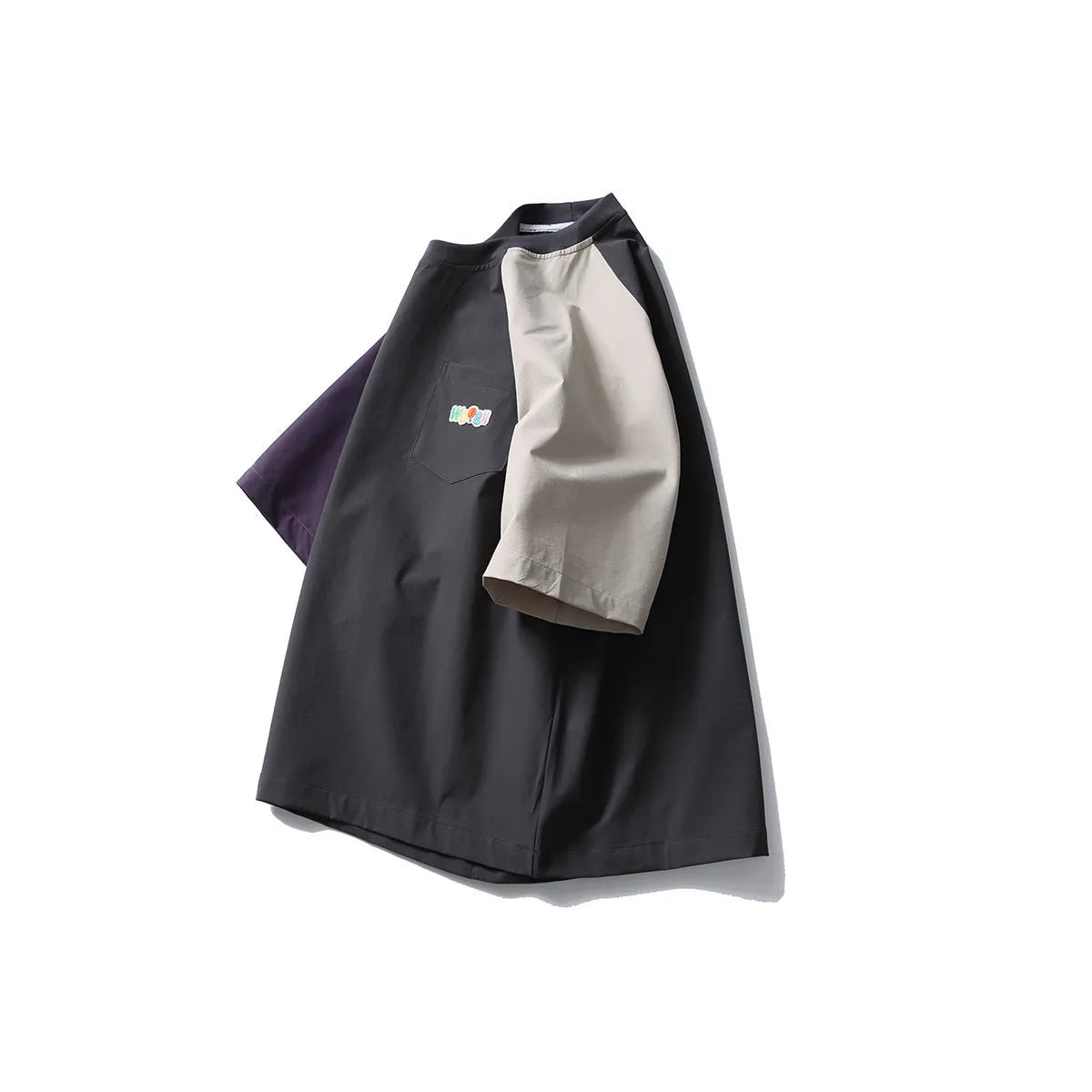 Dark grey loose fit T-shirt with contrast colour raglan sleeves on a hanger