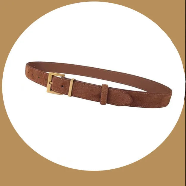 Women's black leather belt with a silver alloy pin buckle on a white background.