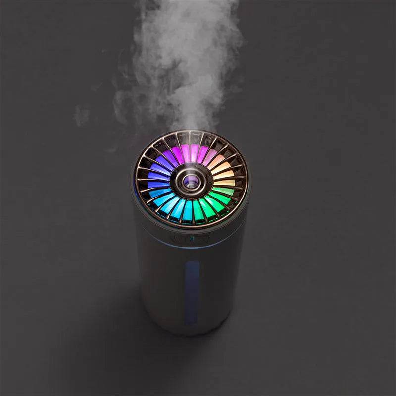 Black portable car humidifier with colourful lights on a car dashboard cup holder