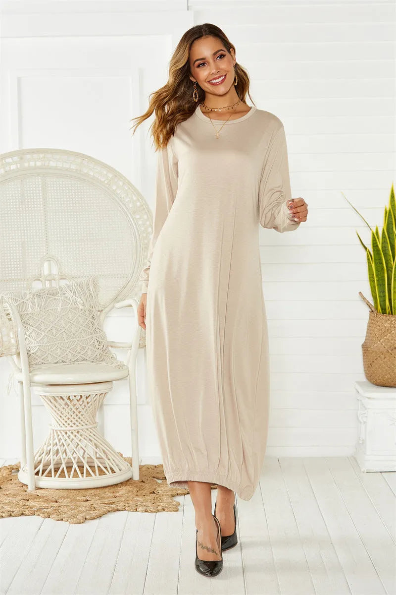 Black long lantern dress with lace-up crew neck and loose knit fit, shown on a model.