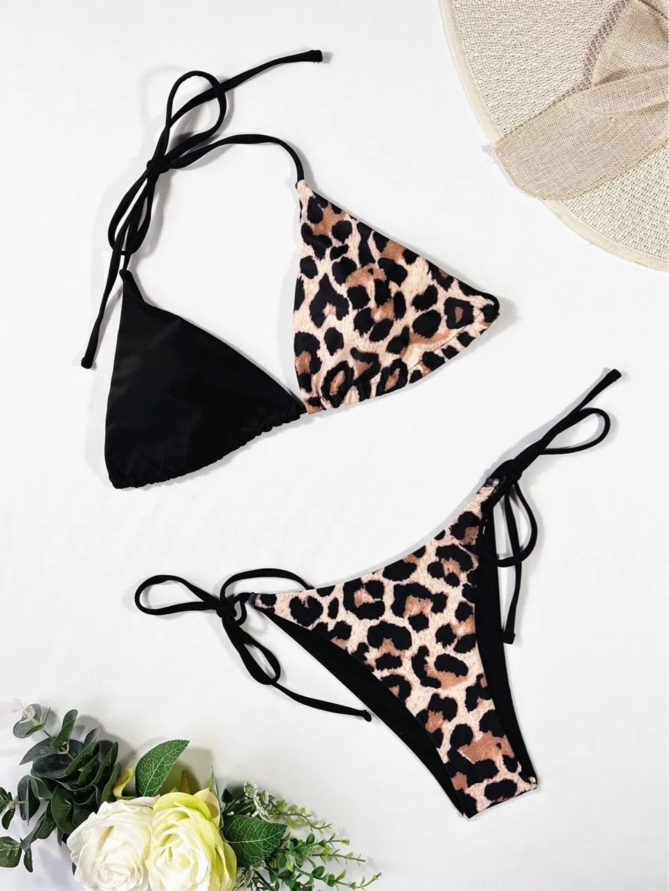 Women's red leopard print halter bikini with lace-up front on a mannequin