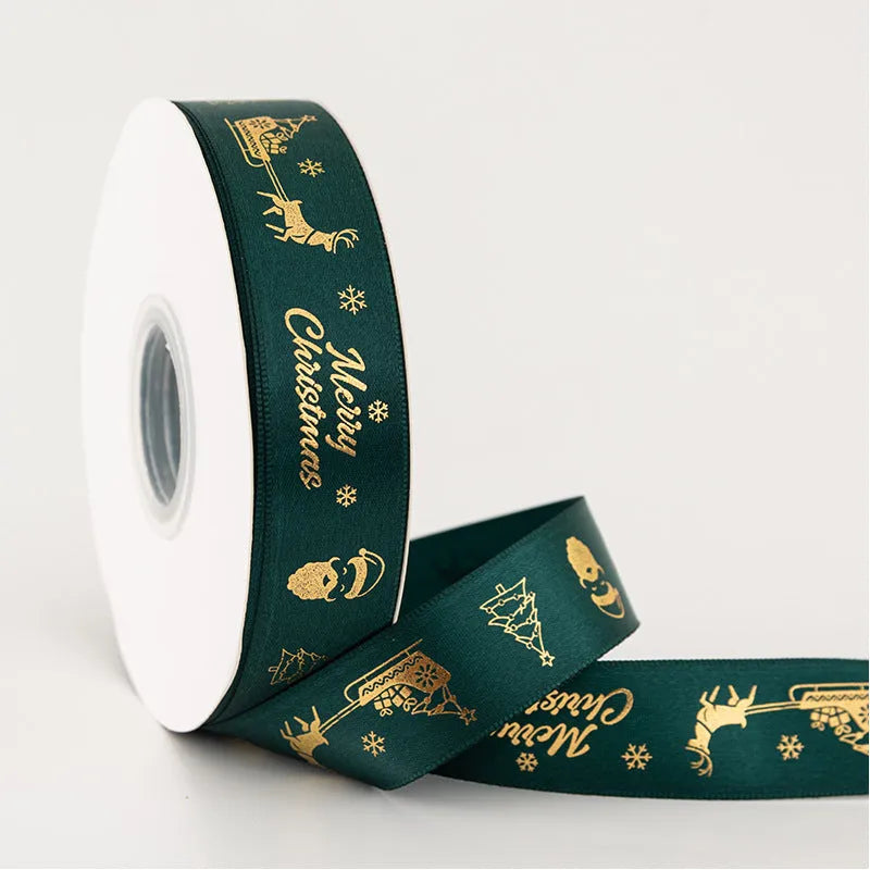 2.5cm Christmas polyester ribbon roll 22m in Ink Green or Red with Elk, bell, Santa, Sled, or Snowman design