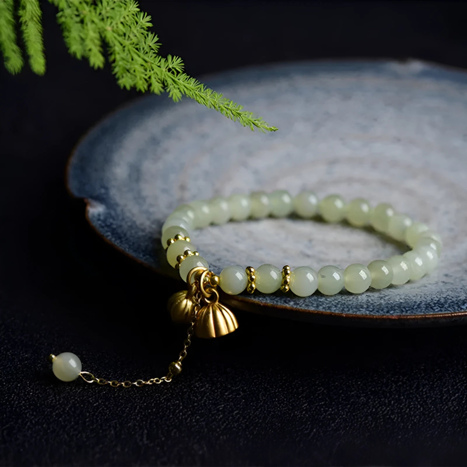Natural Hetian Jade bracelet with Fu character detail on 6mm beads in a sunny water colour.