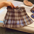 Girls' red and black plaid pleated A-line skirt with a cotton blend fabric.